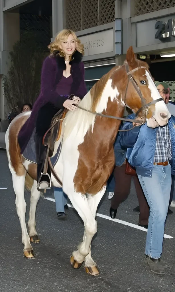 Madonna with a white horse on stage in Las Vegas.