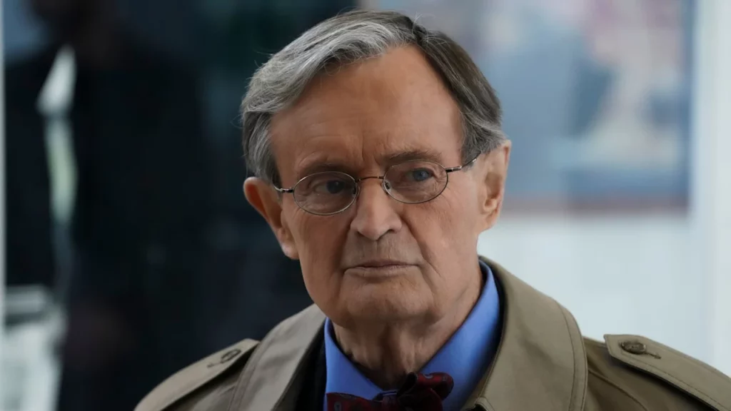 A heartwarming image of David McCallum as Ducky Mallard, possibly in his lab or interacting with another character in a friendly way.