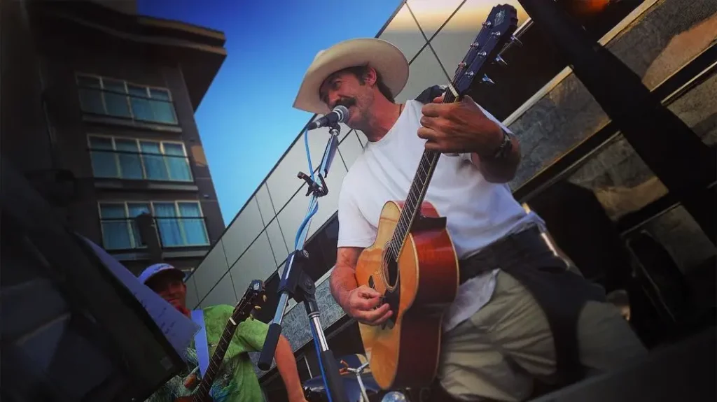 Shaun Johnston performing music at an Alberta ranch