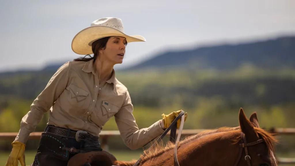 Michelle Morgan as Lou Fleming rides a horse in a Heartland still