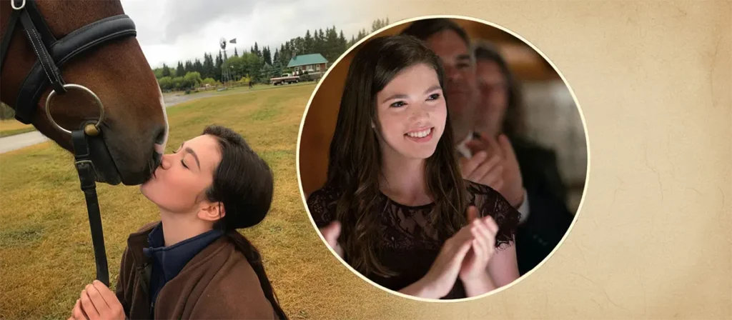 Alisha Newton smiling on-set as Georgie Fleming-Morris on Heartland ranch